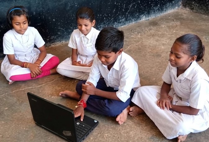 Students engaging with digital literacy tools